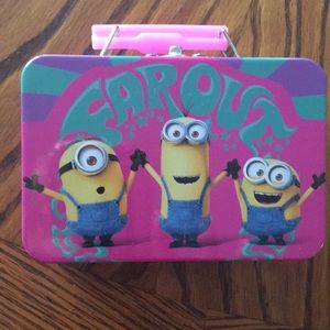 Metal minion box with 4 new lip glosses.